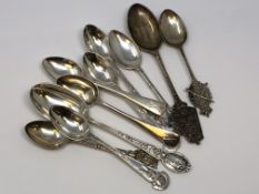 A collection of silver rifle and regimental spoons