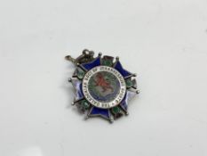 A silver and enamel medal for the Caledonian society of Johannesburg