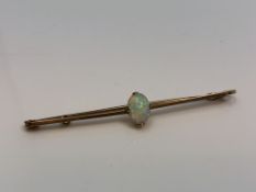 A 15ct gold opal bar brooch CONDITION REPORT: This requires some cleaning but looks
