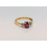 An 18ct yellow gold ruby and diamond ring, 2.5g, size M/N.