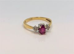 An 18ct yellow gold ruby and diamond ring, 2.5g, size M/N.