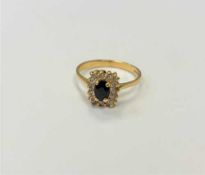 An 18ct gold sapphire and diamond ring, size O/P.