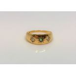 An 18ct gold emeral and two stone diamond ring, size J.