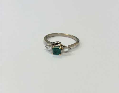 An 18ct gold emerald and diamond ring,