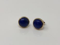 A pair of 9ct gold cabochon lapis lazuli earrings with post fittings.