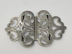 A silver nurse's buckle,