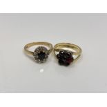 An 18ct gold sapphire and diamond ring and a gold garnet ring (2)