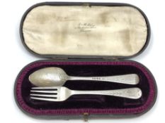 A boxed silver fork and spoon,