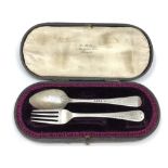 A boxed silver fork and spoon,