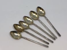 Six ornate silver gilt spoons