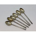 Six ornate silver gilt spoons