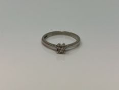 A platinum princess cut diamond solitaire ring, size N CONDITION REPORT: 3.