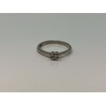 A platinum princess cut diamond solitaire ring, size N CONDITION REPORT: 3.