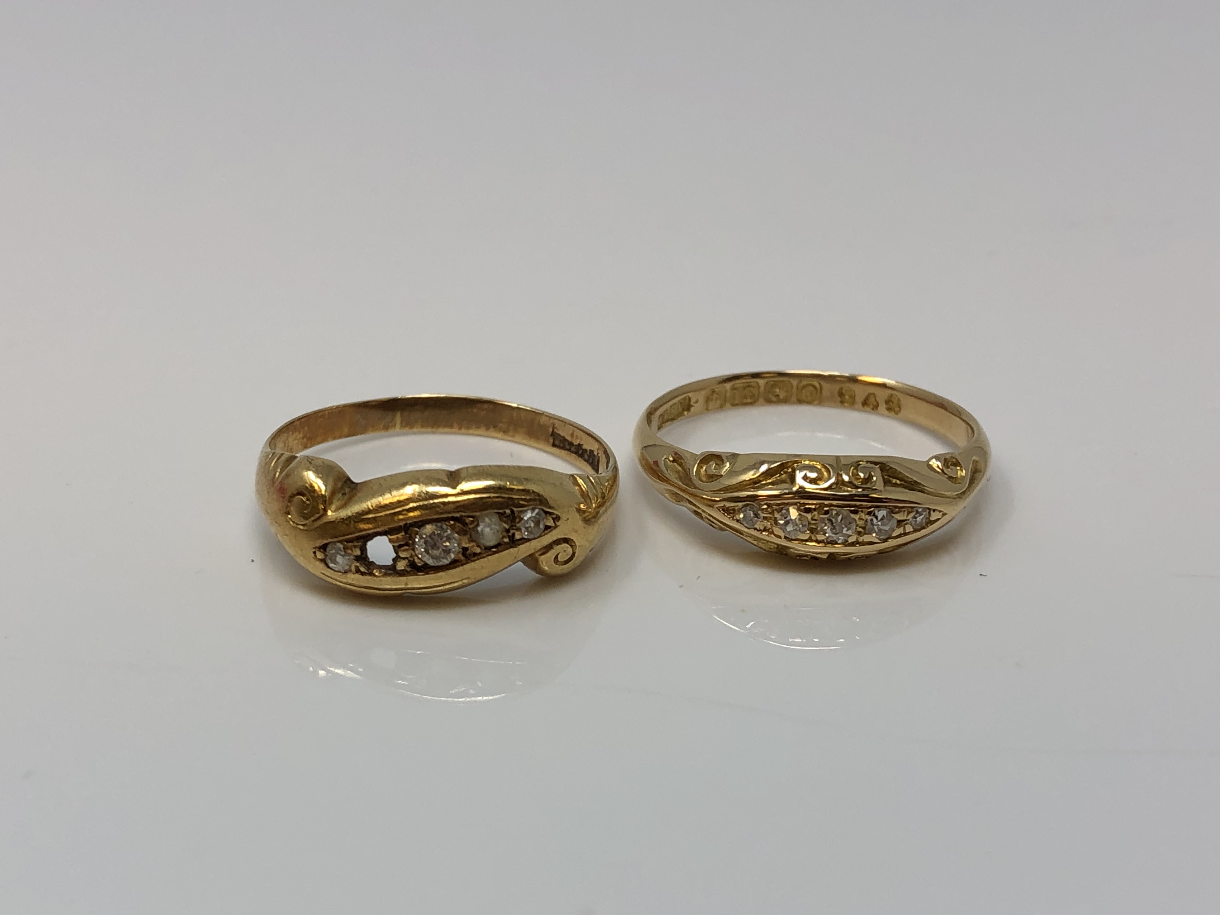 Two antique 18ct gold rive stone diamond rings,