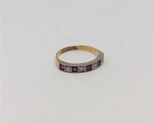 A ruby and diamond half eternity ring, 18CT size O.