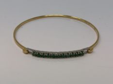 An 18ct gold emerald set bracelet CONDITION REPORT: 5.