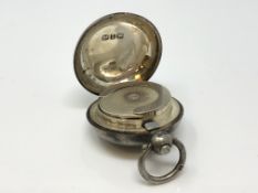 An antique silver sovereign case,