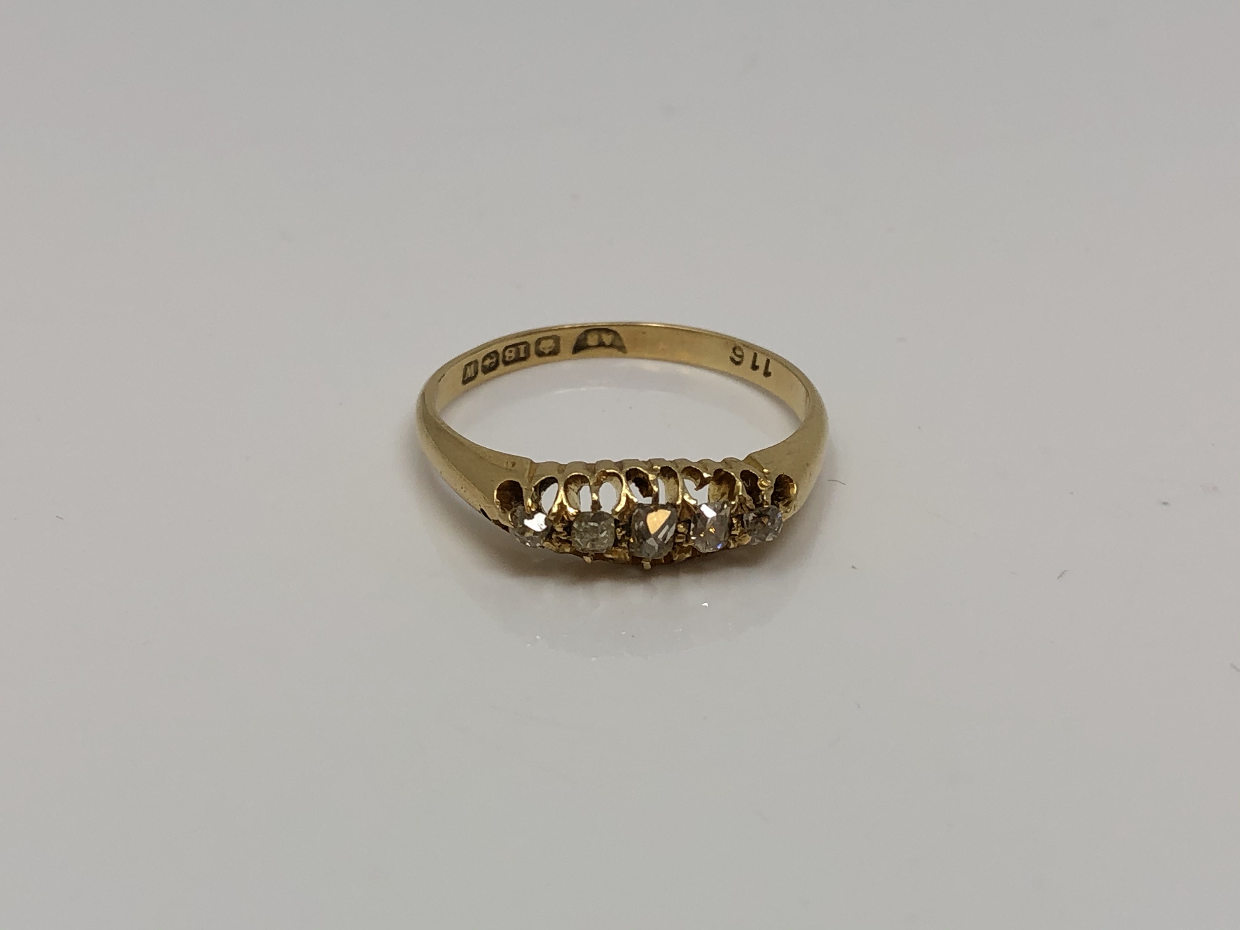 An antique 18ct gold five stone diamond ring, size Q CONDITION REPORT: 2.