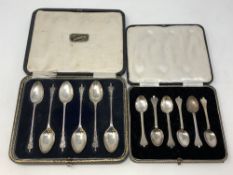 Two boxed sets of six silver spoons