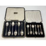 Two boxed sets of six silver spoons