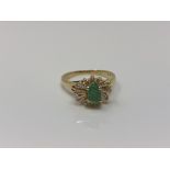 An 18ct gold emerald dress ring, size K CONDITION REPORT: 3.