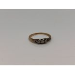 An 18ct gold three stone diamond ring, size I CONDITION REPORT: 1.