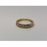 An 18ct gold half eternity dress ring, size P1/2 CONDITION REPORT: 3.