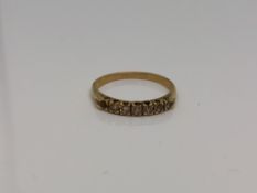 An 18ct gold six stone diamond ring (one stone missing), size N CONDITION REPORT: 1.