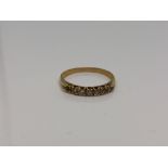 An 18ct gold six stone diamond ring (one stone missing), size N CONDITION REPORT: 1.