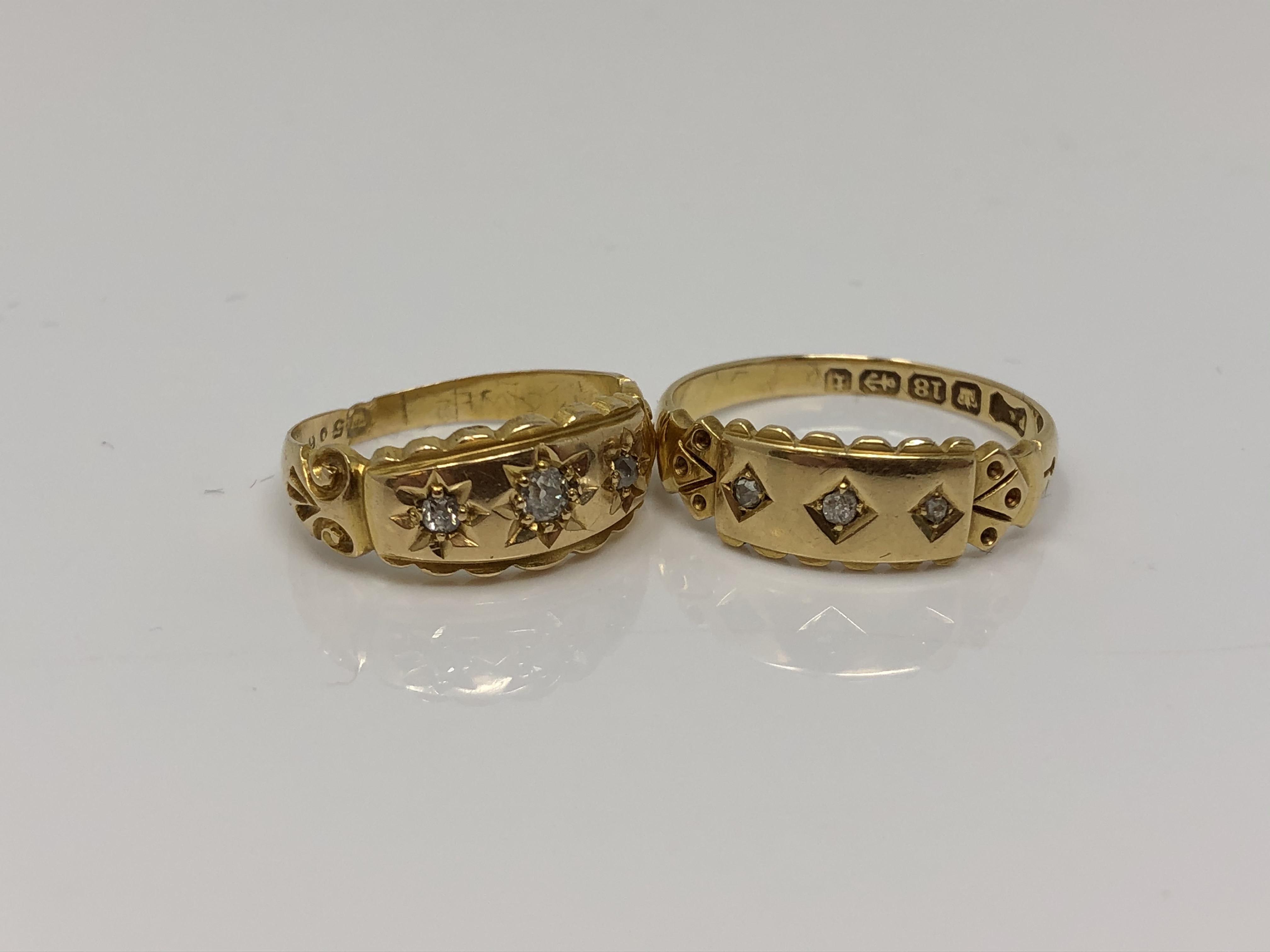 Two antique 18ct gold three stone diamond rings (2) CONDITION REPORT: 5.