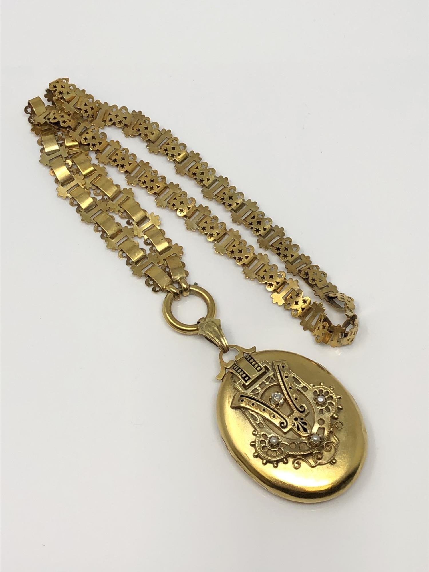 An antique yellow metal pearl and diamond locket and necklace, 38.1g.