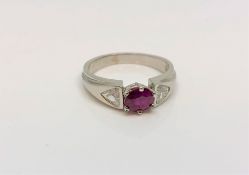 An 18ct white gold ruby and diamond ring, approximately 0.5ct, size K.