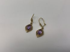 A pair of 9ct gold amethyst drop earrings. CONDITION REPORT: 1.