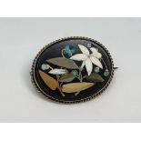 An oval pietra dura brooch in gold frame