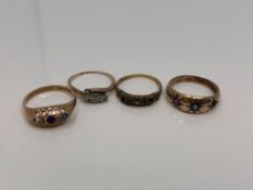 Four antique gold rings set with rubies, sapphires,