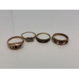 Four antique gold rings set with rubies, sapphires,