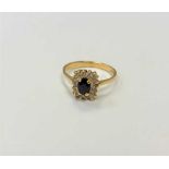 An 18ct gold sapphire and diamond ring, size O/P.