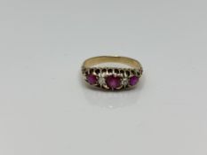 An 18ct gold ruby and diamond ring, size O CONDITION REPORT: 3.