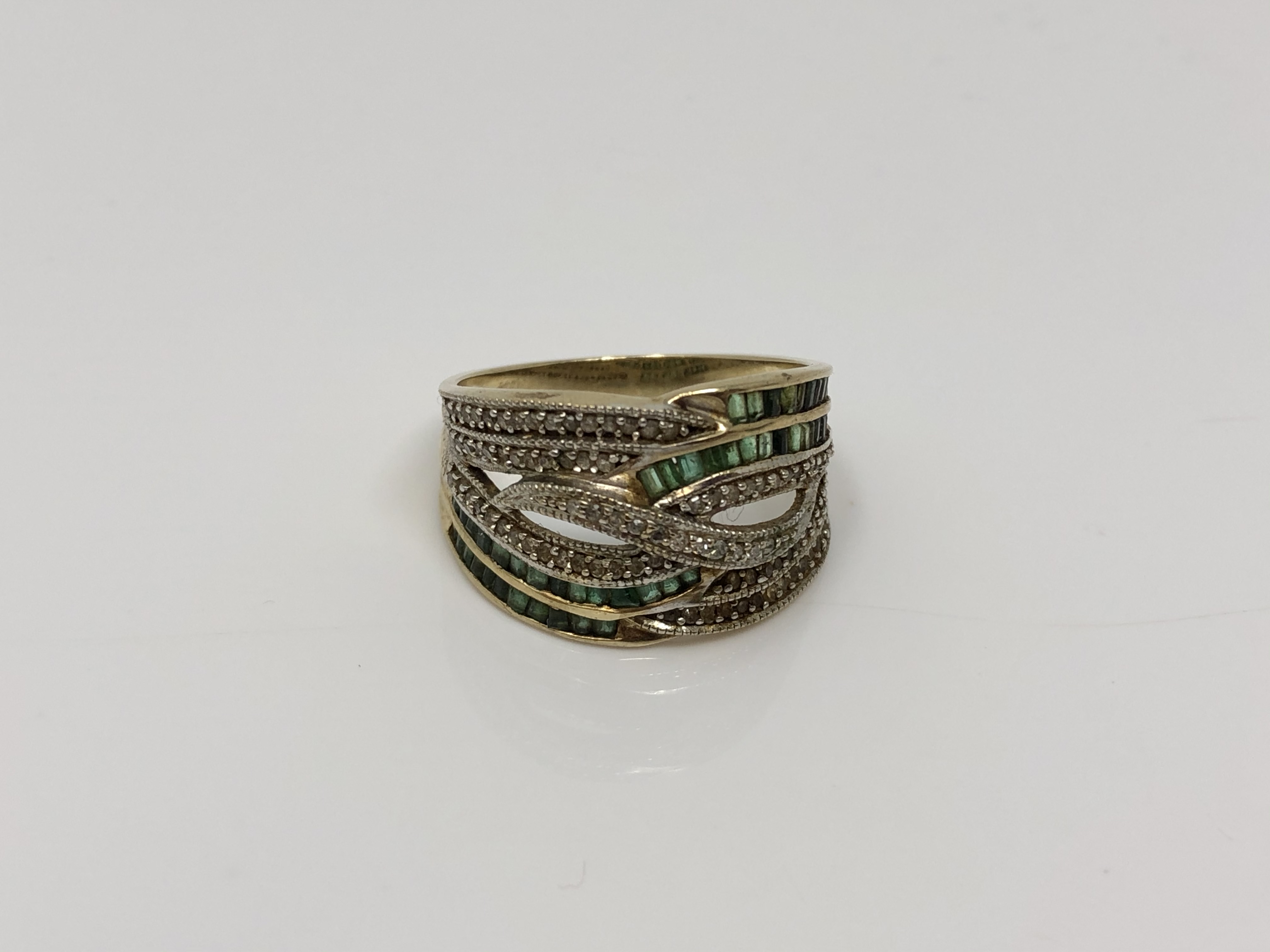 A 9ct gold emerald and diamond set ring, size P CONDITION REPORT: 4.