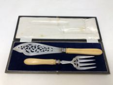 A pair of Victorian silver fish servers with ivory handles,