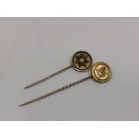 Two gold stick pins; one depicting a sphinx,