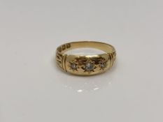 An antique 18ct gold three stone diamond ring, size P CONDITION REPORT: 3.