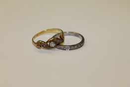 An 18ct gold half eternity diamond ring together with a pearl and diamond ring.