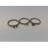 Three platinum vacant ring mounts (3) CONDITION REPORT: 11.