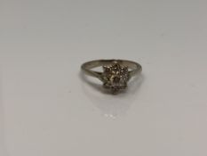 An 18ct white gold diamond cluster ring, size N CONDITION REPORT: 2.