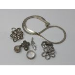 A group of silver jewellery to include an articulated necklace, various pendants,