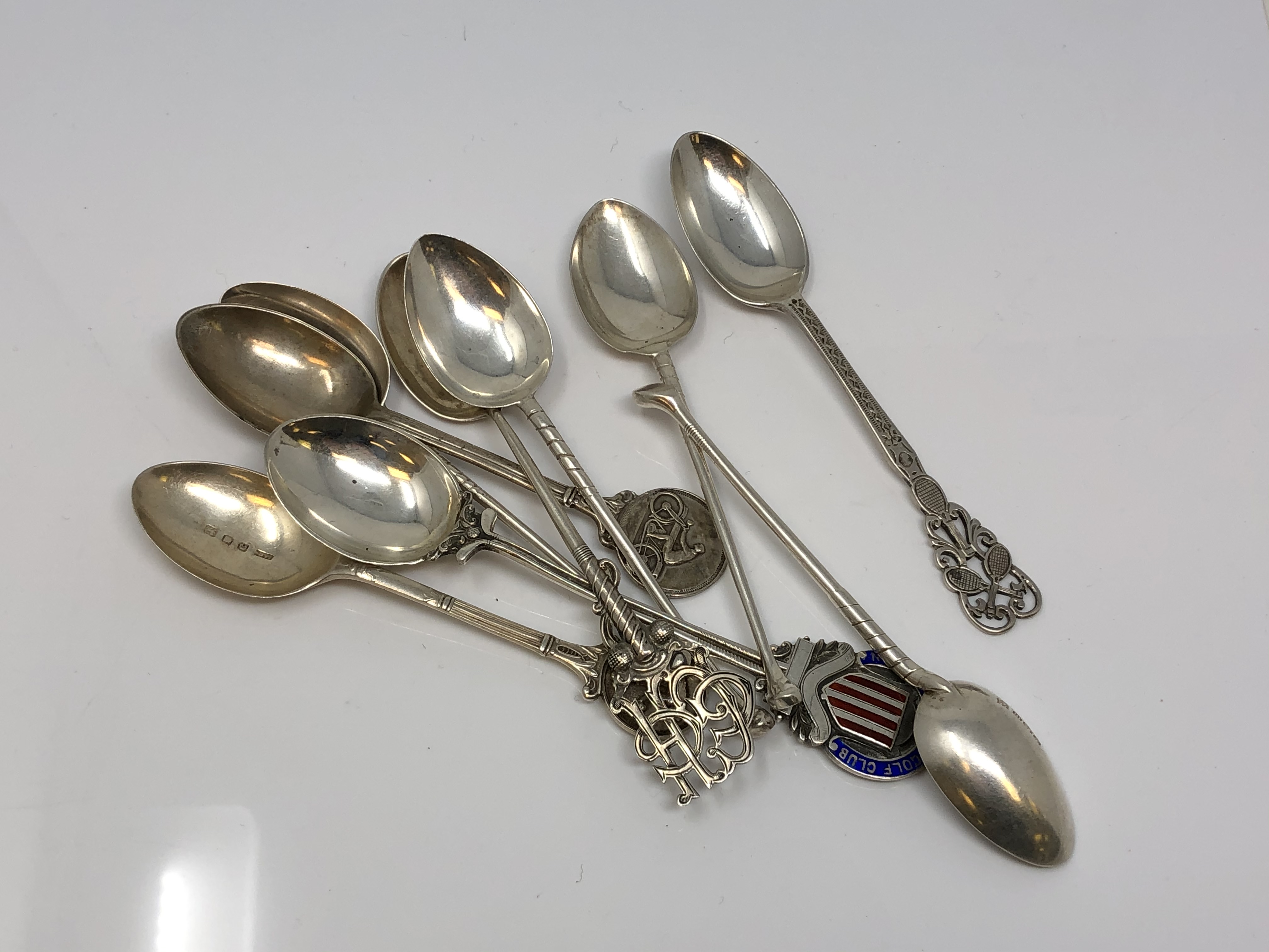 A collection of silver spoons - Tennis, Motorcross, Bowling.