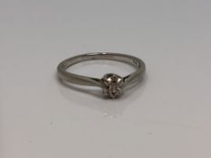 A platinum and diamond solitaire ring, size O CONDITION REPORT: 2.