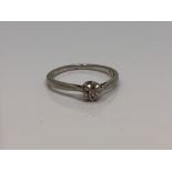 A platinum and diamond solitaire ring, size O CONDITION REPORT: 2.