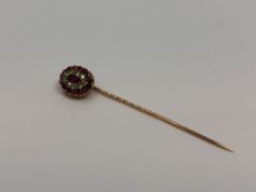 A Russian gold ruby and green garnet stick pin,